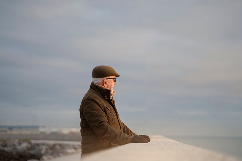 Photo of an elderly man taking a stroll
