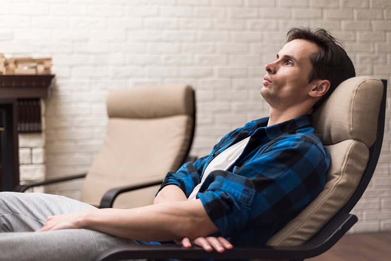 Photo of a man relaxing in a rocking chair