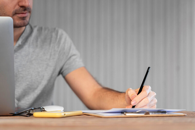 A photo of a man working from home