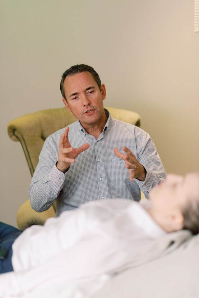 Photo of a therapist in session with a patient