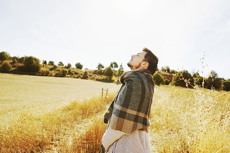 A photo of a man in a field