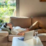 Serene person in deep hypnotherapy relaxation, rewiring subconscious alcohol cravings with calm blue tones and neural pathway visualization