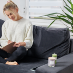 Happy woman journaling peacefully with UM.app to build resilience and manage stress without alcohol